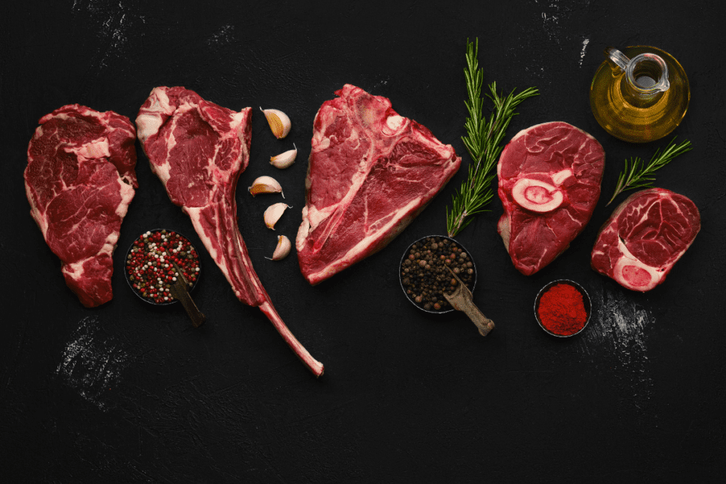 a spread of different types of steak, raw