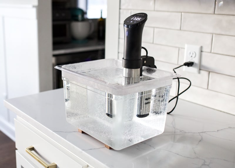 Anova Sous Vide Cooker in LIPAVI container filled with water