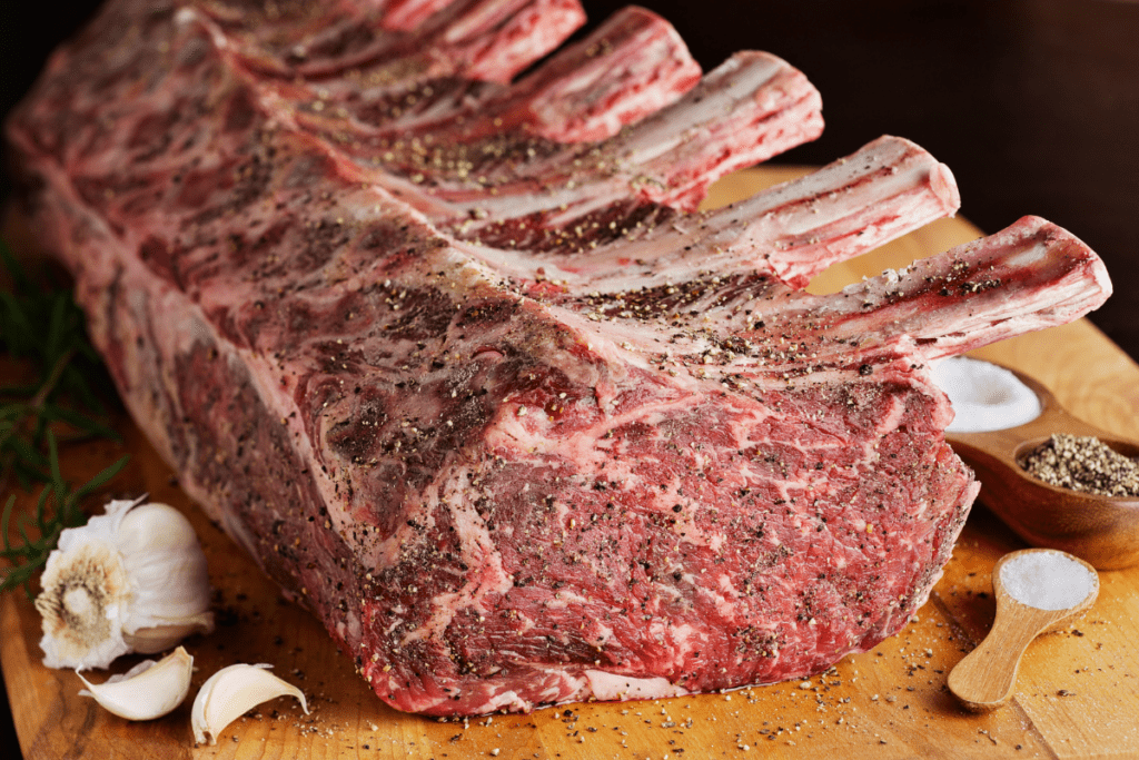 prime rib; large cut with several rib bones showing (rack); meaningfully fatty