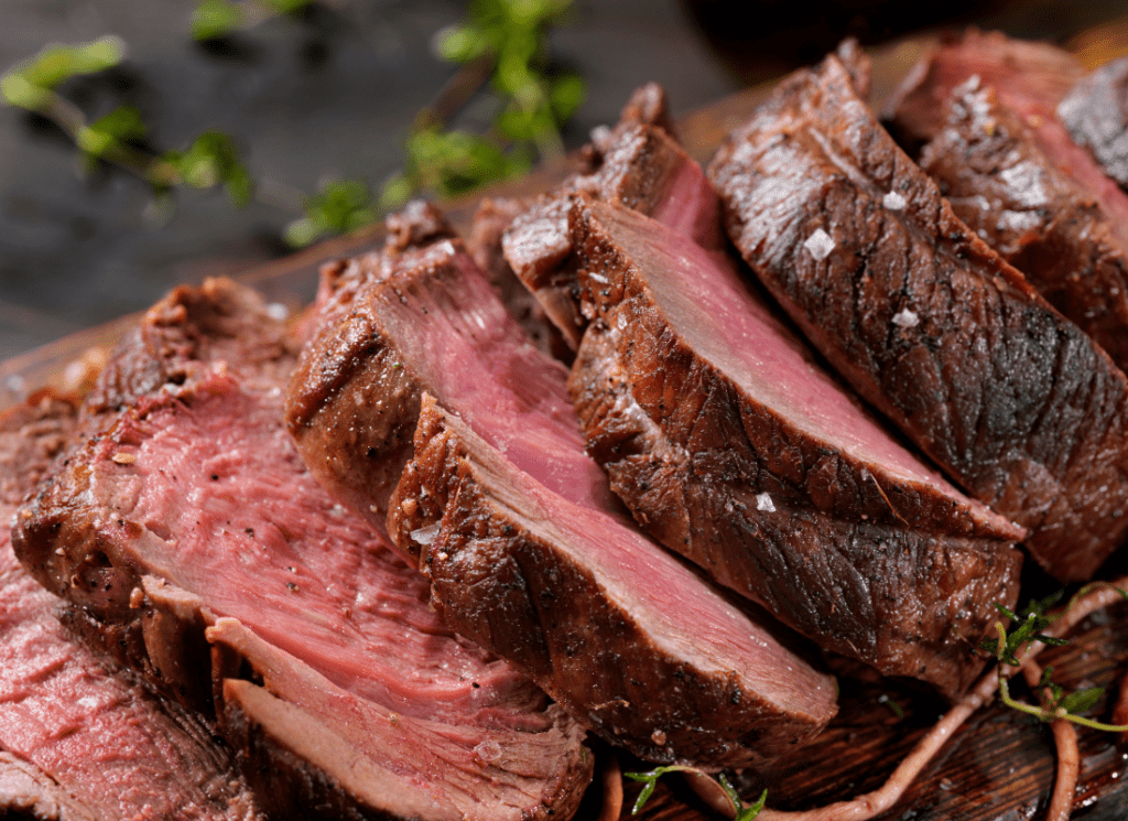 Tri tip steak sliced close-up.
