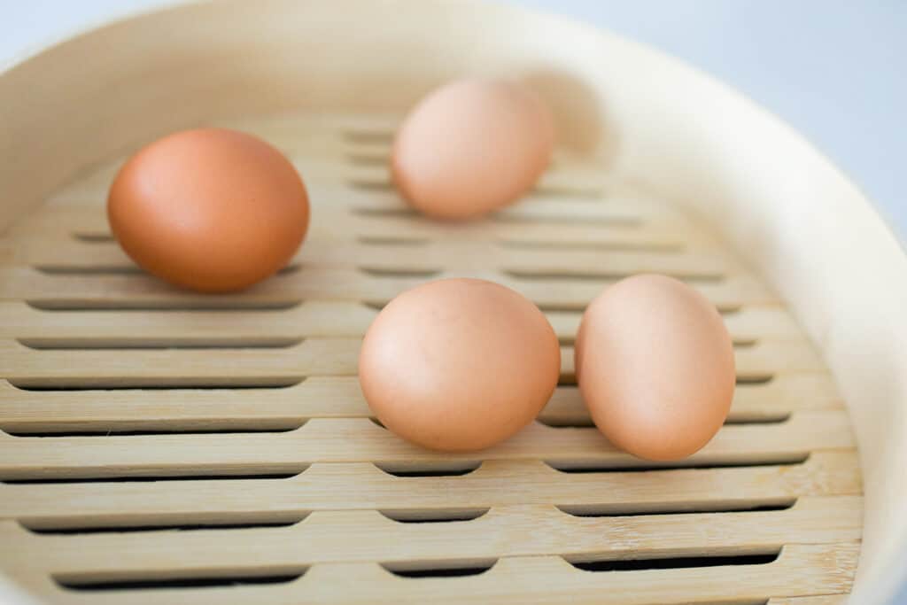 4 eggs in a steamer basket