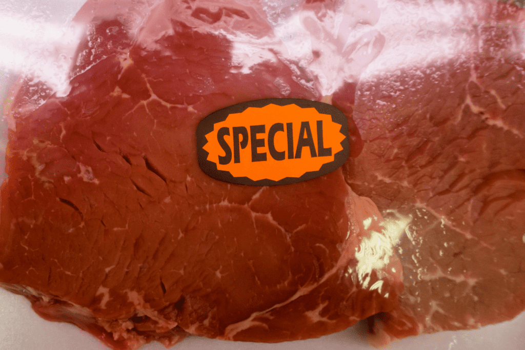 Close-up of sticker "SPECIAL" on steak packaging