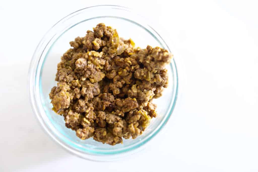 Cooked ground beef in an open Snapware container.