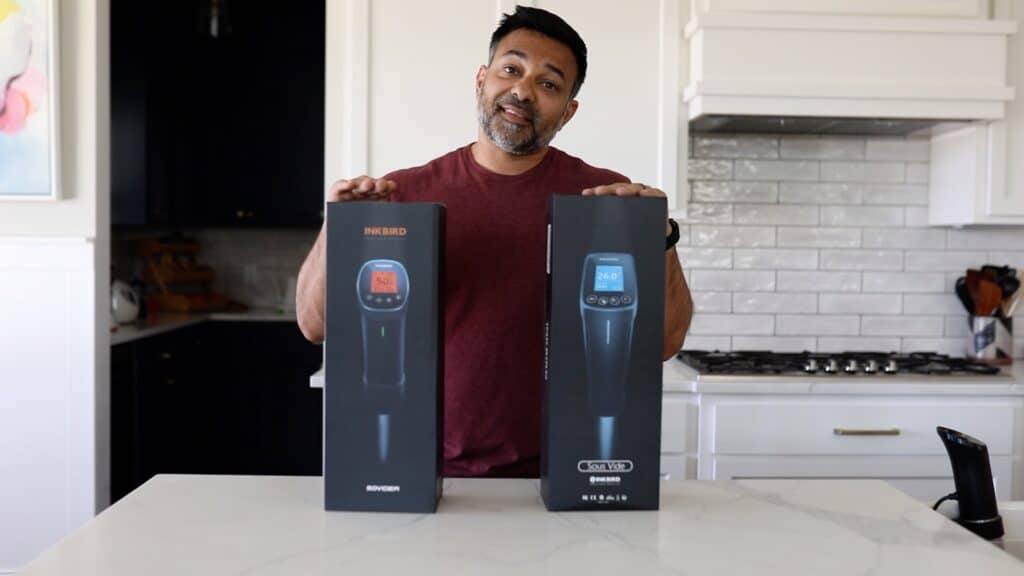 Rishi is displaying two boxed Inkbird sous vide machines; the ISV-100W and the ISV-200W.