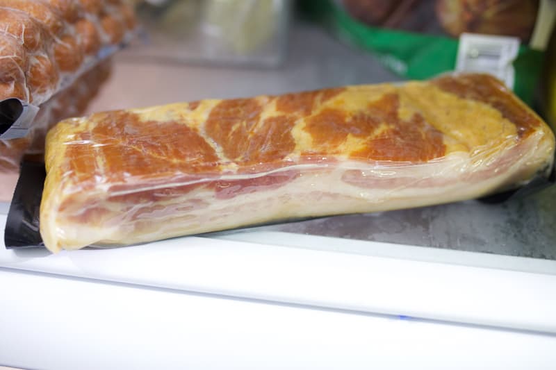 Bacon in a refrigerator.