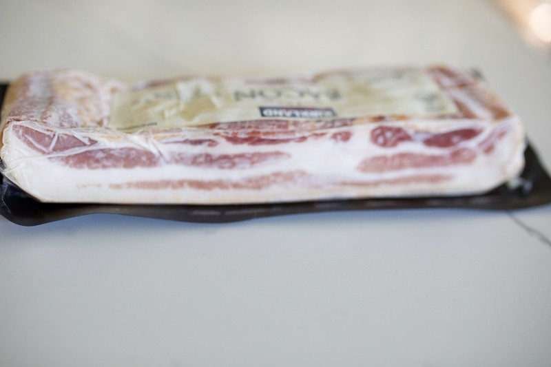 Frozen bacon on countertop.