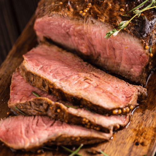 Sous vide roast beef recipe header image. Top round cooked to perfection and sliced.